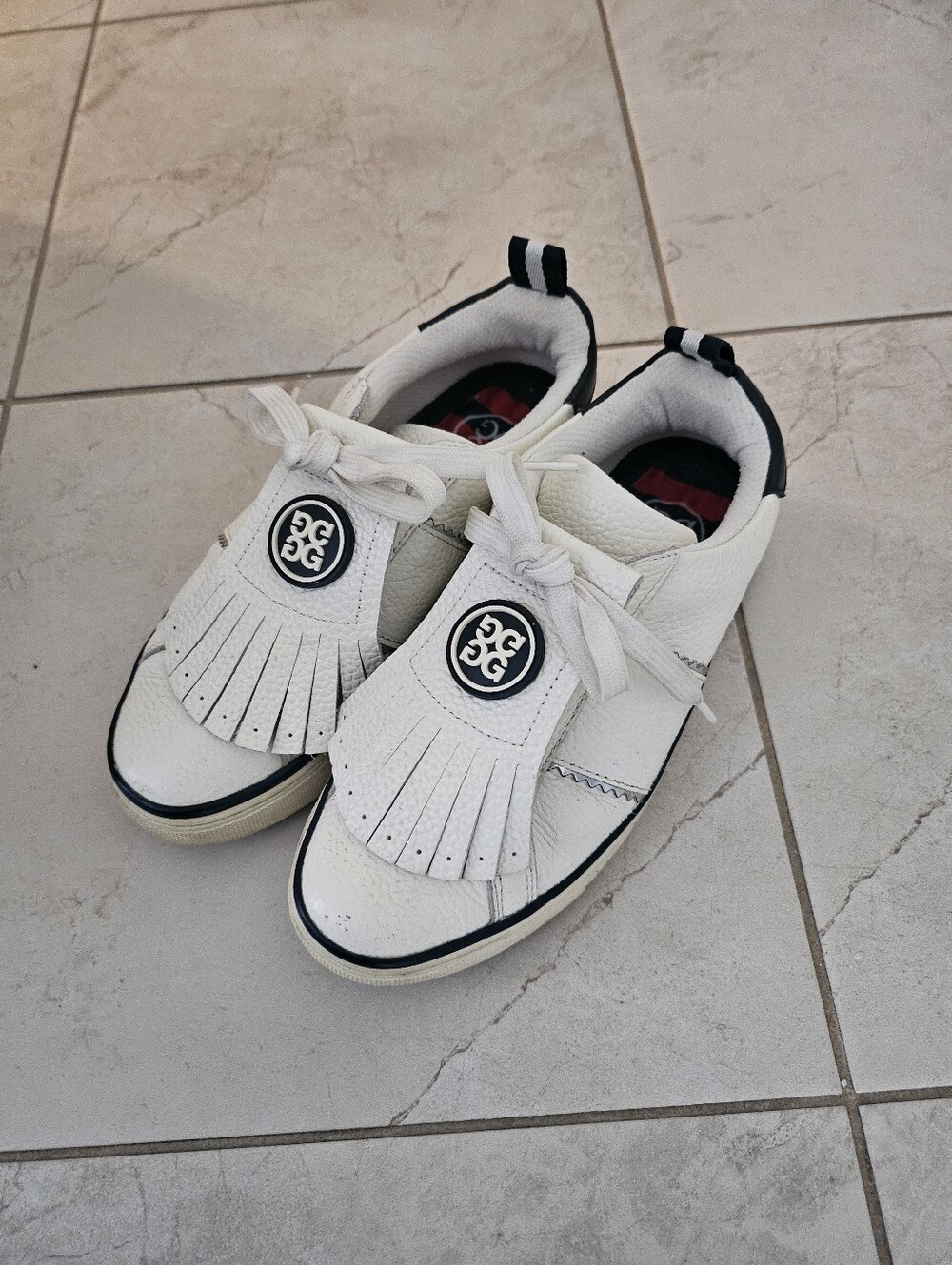 G/FORE White Kids Leather Slip-On Sneakers with Fringe and Logo
